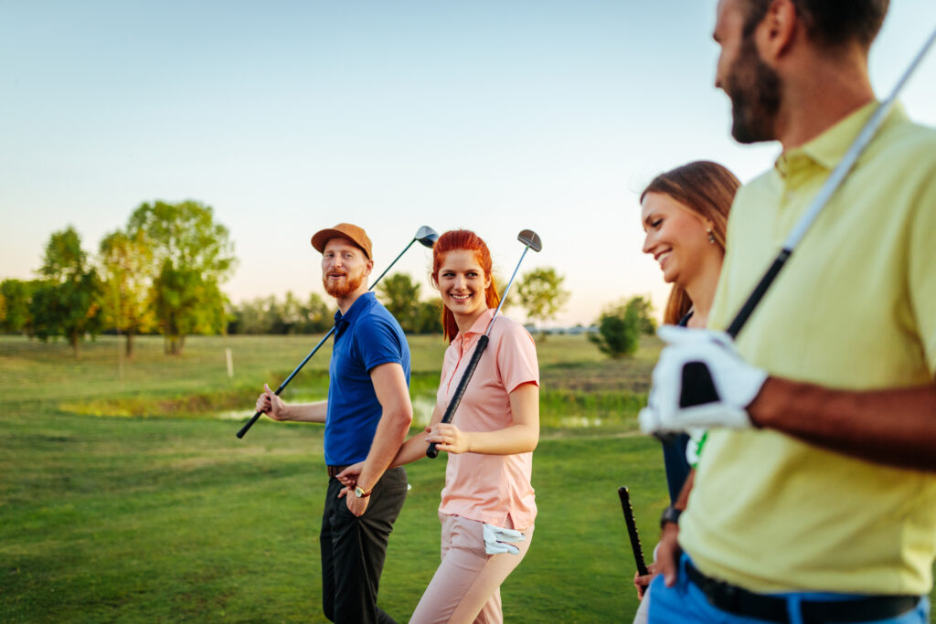 Shot of friends enjoying time on a golf course.